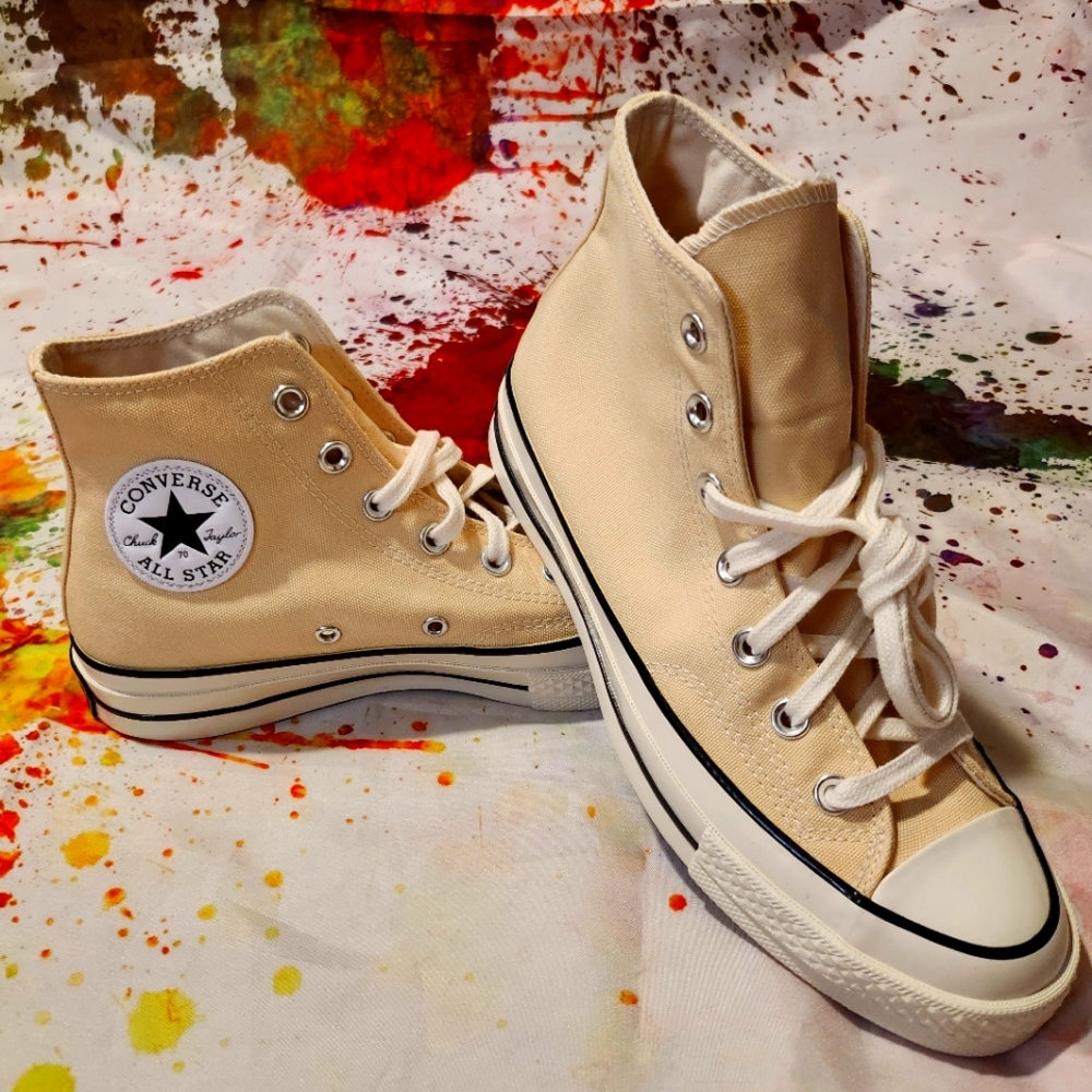 Converse high top sneaker. Light yellow color new in box women's size 8.5
